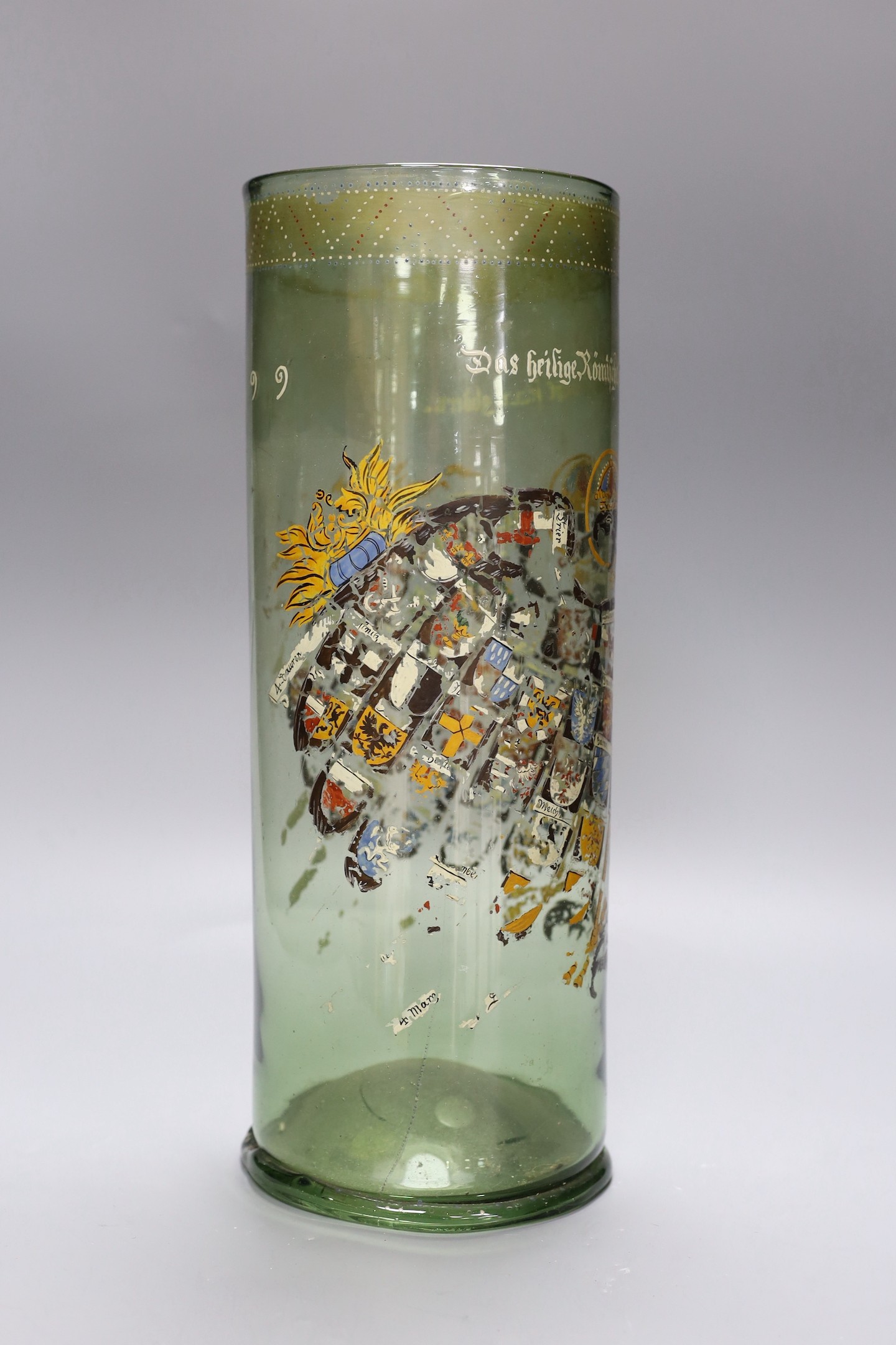 A German glass Humpen with collector's labels on base, painting a little worn, circa 18th century, 39 cms high